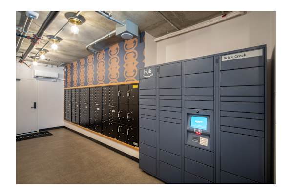 A row of black lockers with a digital display on the front of the first one.
